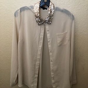 Cream colored long-sleeve dress top